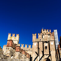 Buy canvas prints of Facade of the castle of Sirmione surrounded by water. by Joaquin Corbalan