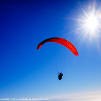 Buy canvas prints of Paragliding above mountain peaks and white clouds during winter  by Joaquin Corbalan