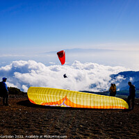 Buy canvas prints of Skydiving experts and monitors prepare the sail of a paraglider  by Joaquin Corbalan