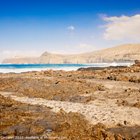 Buy canvas prints of Atlantic rocky coast washed by the ocean on a sunny day with blu by Joaquin Corbalan