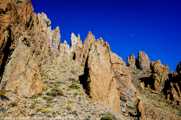 vertical rock stone formations on a bright sky sunny day Picture Board by Joaquin Corbalan