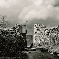Buy canvas prints of Scary entrance to an old stone cemetery with an iron gate. by Joaquin Corbalan