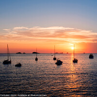 Buy canvas prints of A warm sunset with the sun reflecting on the surface of the sea, by Joaquin Corbalan