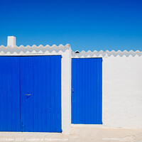 Buy canvas prints of Fisherman's hut with white walls and colorful blue wooden doors  by Joaquin Corbalan