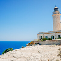 Buy canvas prints of Formentera's lighthouse next to the sea cliff illuminates the co by Joaquin Corbalan