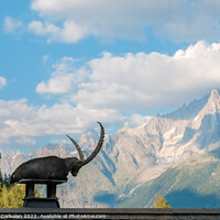 Buy canvas prints of Alpine ibex, goats with long horns, perch on the roofs of houses by Joaquin Corbalan