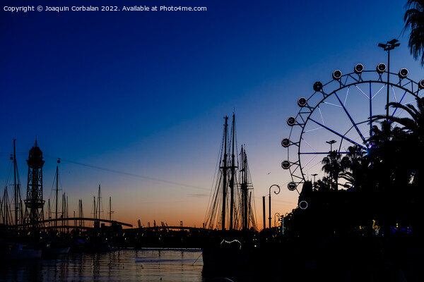 Sunset in the port of Barcelona, with ferris wheel in the backgr Picture Board by Joaquin Corbalan