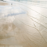 Buy canvas prints of A lone retired person walks away on the sand of a beach in winte by Joaquin Corbalan