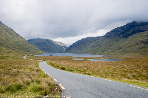 View of Irish Lake Doo with its rugged road Picture Board by Joaquin Corbalan