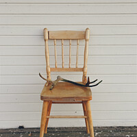 Buy canvas prints of Old vintage wooden chair, with deer antlers by Joaquin Corbalan