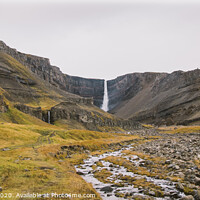Buy canvas prints of Panoramic photos of famous Icelandic waterfalls on cloudy days with geological formations. by Joaquin Corbalan