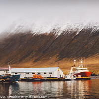 Buy canvas prints of Fishing port of the village of Seydisfjordur, in Iceland, with vibrant colors and reflections in the sea of fishing boats. by Joaquin Corbalan