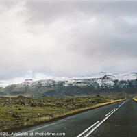 Buy canvas prints of Asphalt mountain roads crossing dangerous Icelandic passes during a trip. by Joaquin Corbalan