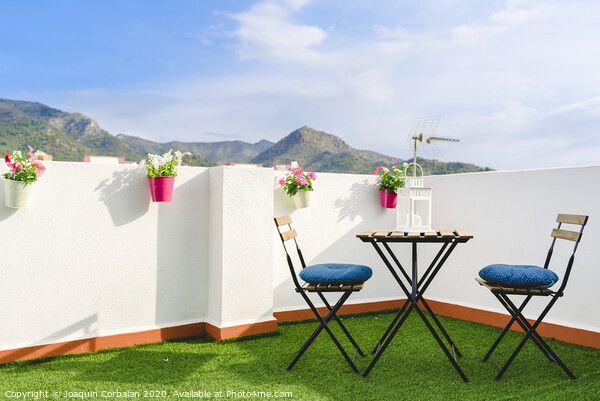 Beautiful white terrace with chairs and coffee table overlooking the Mediterranean mountain, blue sky. Picture Board by Joaquin Corbalan