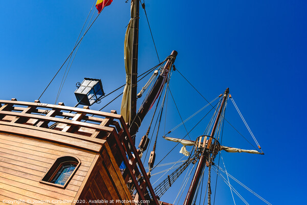 Stern of old galley docked in port to navigate the ocean in the discovery of America. Picture Board by Joaquin Corbalan