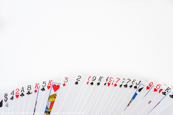 Deck of cards deployed with a white background and space for text. Picture Board by Joaquin Corbalan