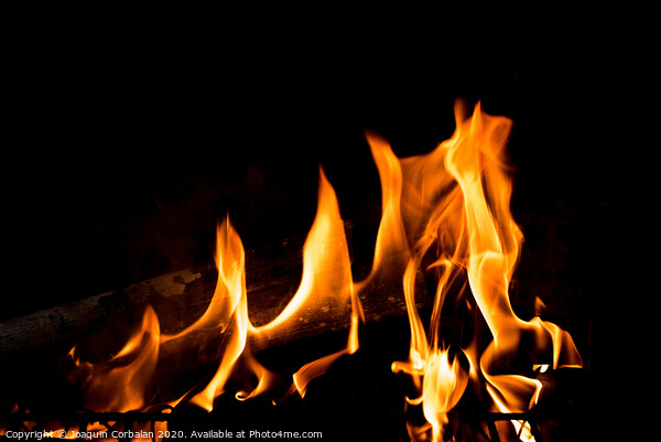 Flames in the fire of a red and yellow barbecue. Picture Board by Joaquin Corbalan