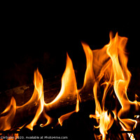 Buy canvas prints of Flames in the fire of a red and yellow barbecue. by Joaquin Corbalan