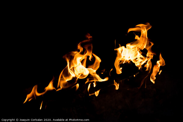 Flames in the fire of a red and yellow barbecue. Picture Board by Joaquin Corbalan