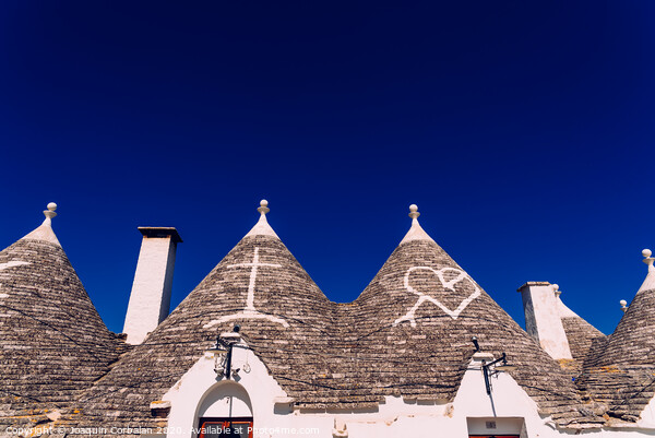Roofs with symbols in the trulli, in the famous Italian city of Alberobello. Picture Board by Joaquin Corbalan