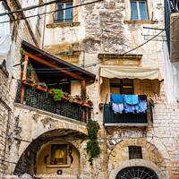 Buy canvas prints of Colorful and old alleys of the touristic Italian city of Bari. by Joaquin Corbalan