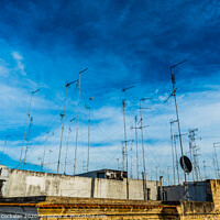 Buy canvas prints of Old buildings in the city of Bari with roofs full of old television antennas. by Joaquin Corbalan