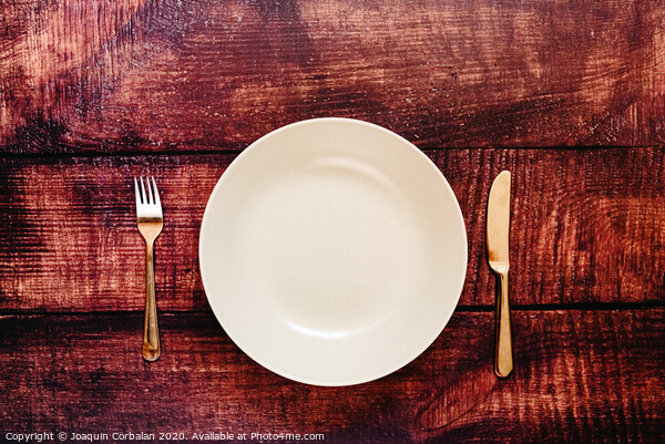 Empty plate with cutlery, top view, concept of intermittent fasting diet to lose weight. Picture Board by Joaquin Corbalan