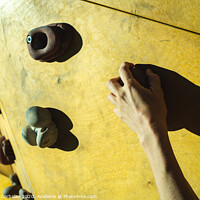 Buy canvas prints of Hand of a person trying to climb the fixie of a climbing wall by Joaquin Corbalan