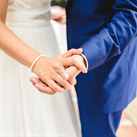 Buy canvas prints of Boyfriends on their wedding day holding hands romantically. by Joaquin Corbalan