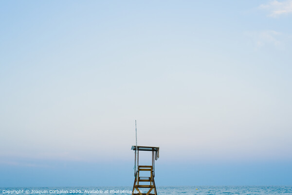 Lifeguard watchtower on the beach at sunset. Picture Board by Joaquin Corbalan