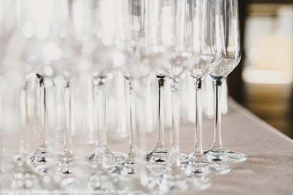 Group of empty and transparent champagne glasses in a restaurant.Group of empty and transparent champagne glasses in a restaurant. Picture Board by Joaquin Corbalan