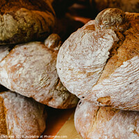 Buy canvas prints of Mediterranean traditional handmade round breads by Joaquin Corbalan