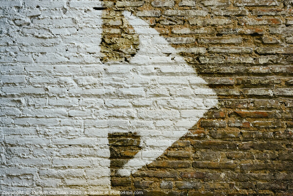 Brick wall with big white arrow indicating direction, background with copy space. Picture Board by Joaquin Corbalan