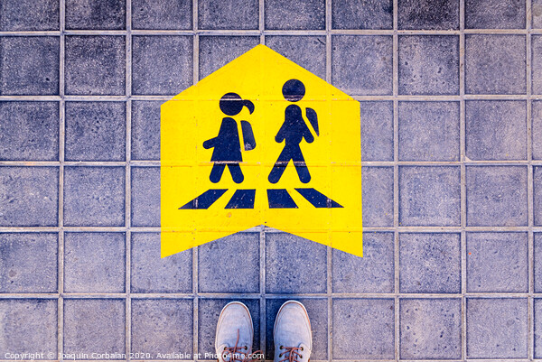 Foot standing on a street a safe way mark for children on the way to school. Picture Board by Joaquin Corbalan