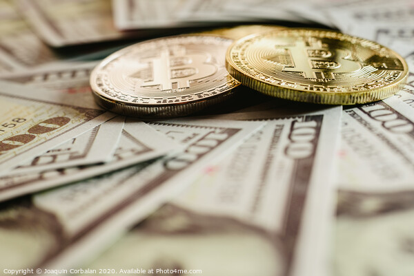 real bitcoins with a value higher than hundreds of dollars in bills. Picture Board by Joaquin Corbalan