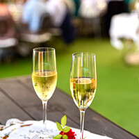 Buy canvas prints of Pair of champagne glasses on a tray to celebrate the love of a couple. by Joaquin Corbalan