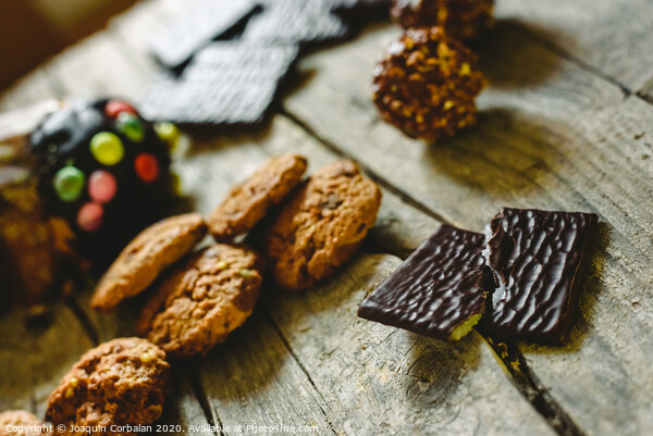 Chip cookies and chocolates pralines to take pleasure in Christmas holidays Picture Board by Joaquin Corbalan