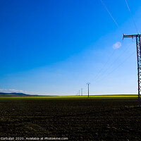 Buy canvas prints of View of a colorful farming field with electricity towers by Joaquin Corbalan