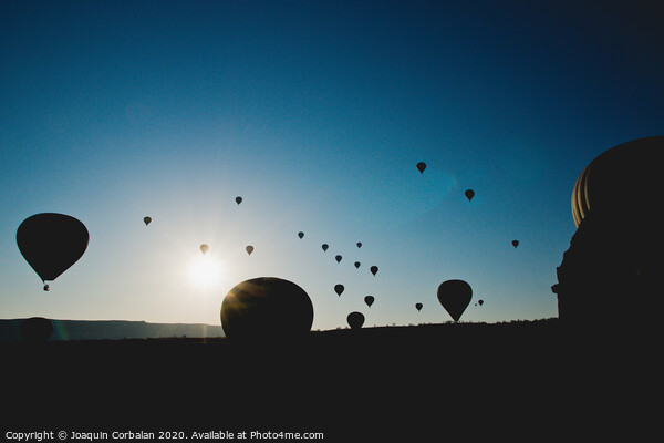 Colorful balloons flying over mountains and with blue sky Picture Board by Joaquin Corbalan