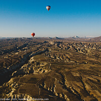 Buy canvas prints of Colorful balloons flying over mountains and with blue sky in cappadocia by Joaquin Corbalan