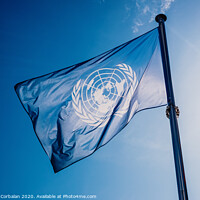 Buy canvas prints of UN flag waved against the sun and blue sky. by Joaquin Corbalan