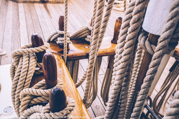 Boat mooring ropes wound on a sailboat. Picture Board by Joaquin Corbalan