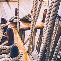 Buy canvas prints of Boat mooring ropes wound on a sailboat. by Joaquin Corbalan