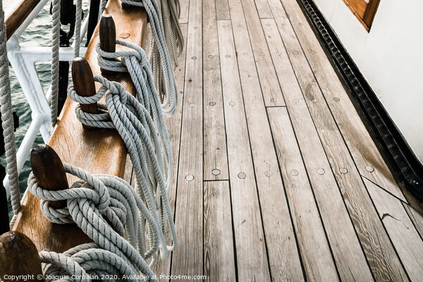 Ropes on a sailboat to tighten the sails of the ship during a cruise for tourists. Picture Board by Joaquin Corbalan