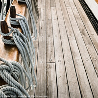 Buy canvas prints of Ropes on a sailboat to tighten the sails of the ship during a cruise for tourists. by Joaquin Corbalan