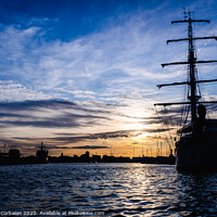 Buy canvas prints of A classic sailboat moored to port in a beautiful sunset. by Joaquin Corbalan