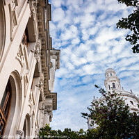 Buy canvas prints of Facade of large institutional building with large columns and windows, background sky, low angle shot, in Valencia. by Joaquin Corbalan