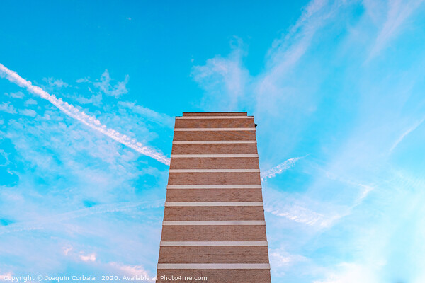 High housing building with blue sky in the background and copy space. Picture Board by Joaquin Corbalan