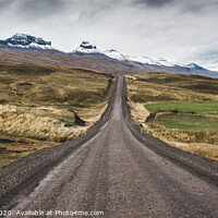 Buy canvas prints of Gravel road in the snowy mountains of Iceland after a rainy day with mud by Joaquin Corbalan