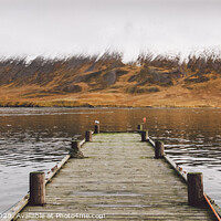 Buy canvas prints of Small wooden pier centered on a lake, facing a snowy mountain. by Joaquin Corbalan